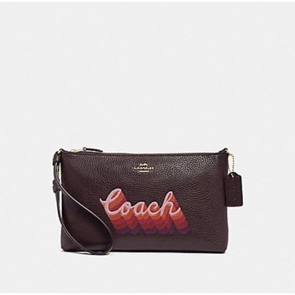 LARGE WRISTLET 25 WITH NEON COACH SCRIPT COACH NWT